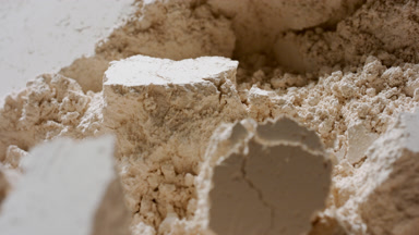 Extreme Macro Slow Motion of Beige Powder Surface