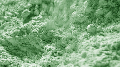 Slow Motion Close-Up of Disturbed Pale Green Powder