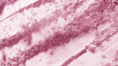 Light Pink Powder Particles Blown Away in Slow Motion