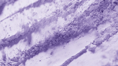 Violet Powder Particles Dispersed in Slow Motion