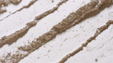 Beige Powder Sifting Down in High-Detail Slow Motion