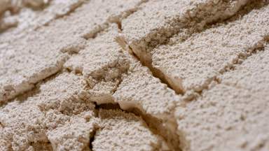Intimate Close-Up of Disturbed Beige Sifted Powder