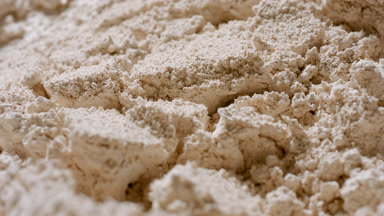 Extreme Close-Up of Split Beige Powder with Mango Concept