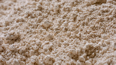 Beige Powder Surface in Slow Motion with Cosmetic Concept