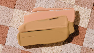 Smeared Foundation Cream Over Brown Mosaic Background