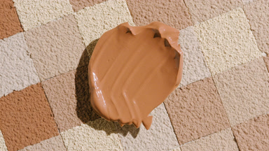 Dynamic Shadow from Dark Foundation on Blue Powder Background