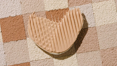 Heart-Shaped Foundation Shadow on Skin Tone Mosaic