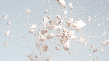 Slow Motion Collision of Light Beige Powders on Grey