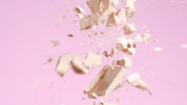Detailed Slow-Motion Beige Powder Collision on Pink Surface
