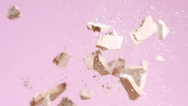 Macro Slow-Motion Beige Powder Collision on Pink Background