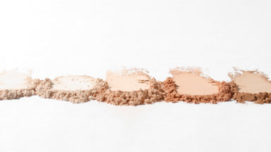 Five Beige Powder Smudges on Light Grey with Dynamic Light