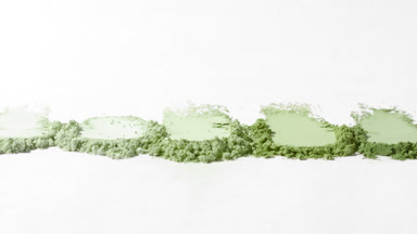 Pale Green Powder Smears on Light Grey Backdrop