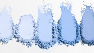 Blue Powder Smears on Light Grey Backdrop