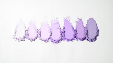 Violet Loose Powder Smears on Soft Gray Backdrop