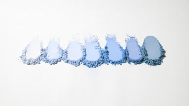 Blue Powder Smudges on Muted Grey Background