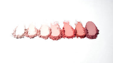 Structured Pink Powder Smears on Light Gray Background