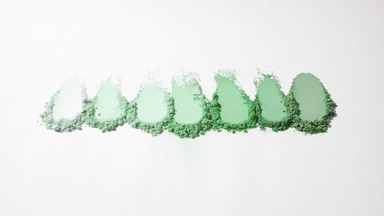Green Loose Powder Smears on Faint Grey Backdrop