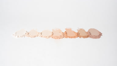 Dynamic Shadows of Beige Powder on Grey Background