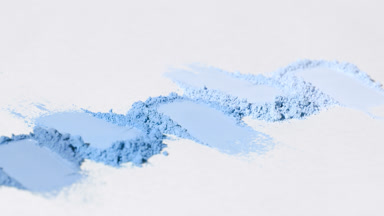 Blue Powder Streaks on Light Gray with Shifting Shadows