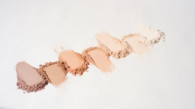 Vertical Arc of Seven Beige to Brown Powder Smears