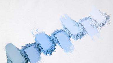 Vertical Orbit of Seven Blue Powder Smears on Light Gray