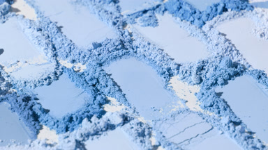 Close-Up of Blue Powder Heaps with Shifting Shadows
