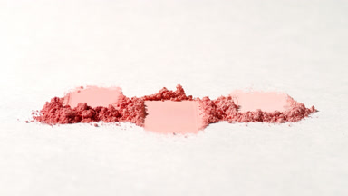 Extreme Close-Up of Red Powder Streaks for Blush Campaign