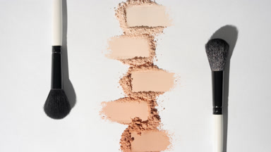 Beige Powder Smears with Brushes on Light Grey Background