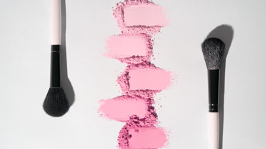 Pink Smeared Powder Heaps on Light Grey Background