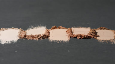 High-Magnification Close-Up of Beige Powder with Shadows
