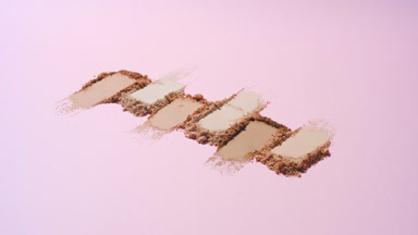 Curved Shot of Beige to Brown Powder Smears on Light Pink
