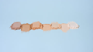 Vertical Orbit of Skin Tone Powder Streaks with Light