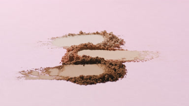 Macro Close-Up of Aligned Skin Tone Powder Smudges