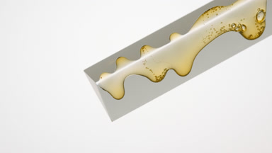 Cascading Yellow Honey on Glass Prism and White Canvas
