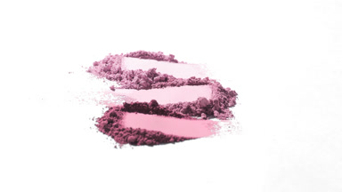 Pink Powder Piles on Subtle Grey Surface with Shadows