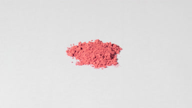 Ultra-Close Red Powder Shot on Light Gray Background