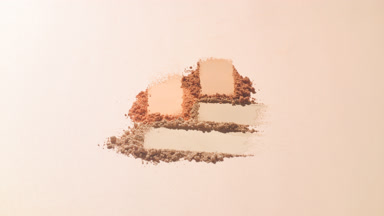 Slow-Motion Close-Up of Beige and Orange Powder Smears