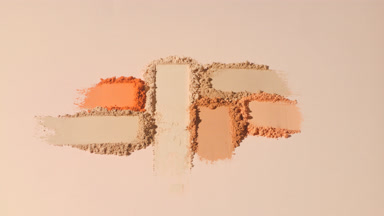 Macro Close-Up of Beige and Orange Powder with Shadows