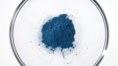 Torrent of Blue Dust in Petri Dish from Above