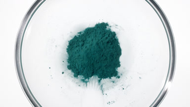 Cyan Powder Torrent in Petri Dish from Above
