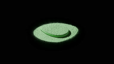 Close-Up of Green Powder on Black Canvas with Dynamic Light