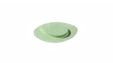 Slow-Motion Close-Up of Green Powder on Teardrop Puff