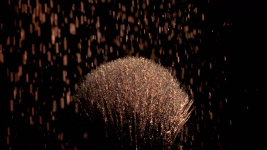 Brown Powder Falling on Black Brush for Contour Ad