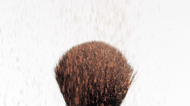 Slow Motion Close-Up of Brown Powder on Black Brush
