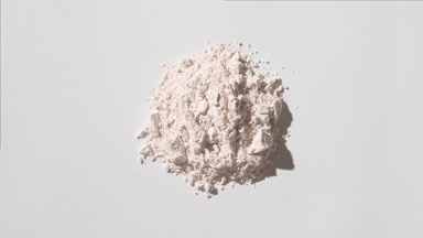Light Beige Powder Stack on Light Gray Background