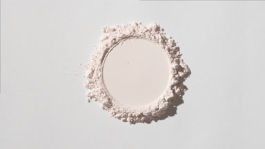 Heap of Light Beige Powder with Circular Trace on Faint Grey