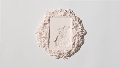 Top-Down View of Light Beige Powder with Rectangle Imprint