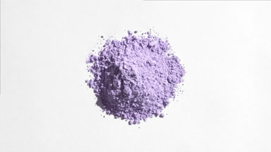 Top View of Pastel Violet Powder on Light Grey Background