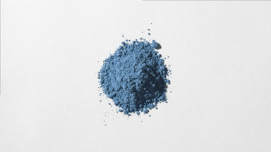 Blue Powder on Light Grey Backdrop with Dynamic Shadows