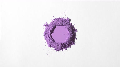 Violet Powder with Hexagonal Indentation on Grey Surface